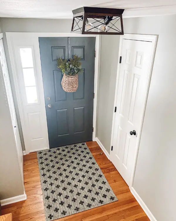 A pretty light that you love adds pizzazz to the entryway.