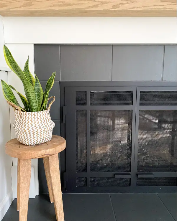 The painted tiles on the fireplace when the makeover was completed.