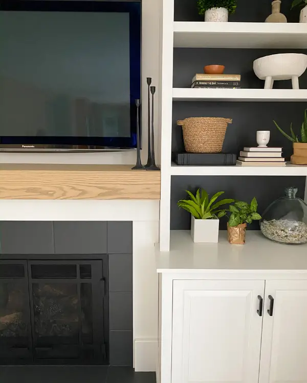 I painted black behind the shelves as well as the tiles. Here is the DIY mantel up close.