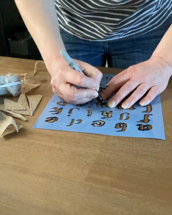 Stencil your message using a stencil and Sharpie.