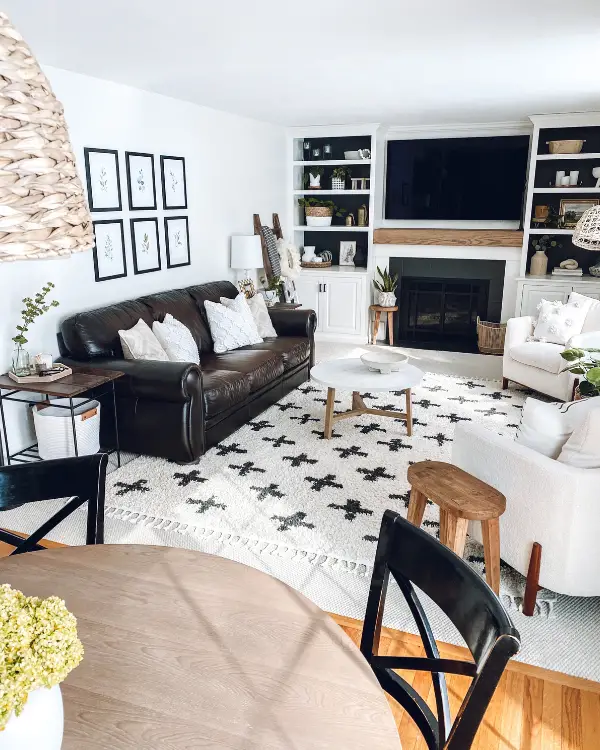 The family room makeover completed, which included a diy mantel and painting the tiles.