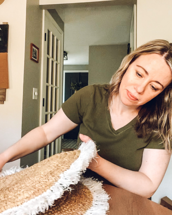 Glue part of the two placemats together.