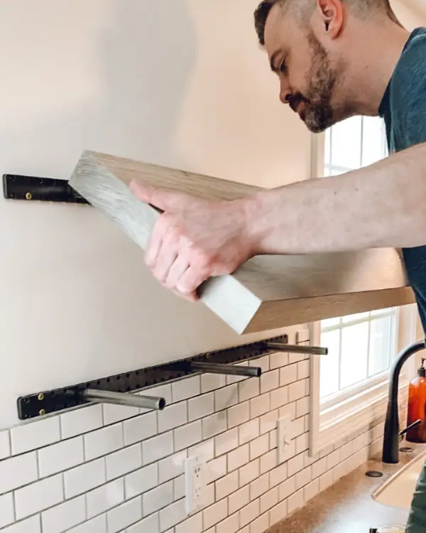 Sliding the shelves onto the brackets