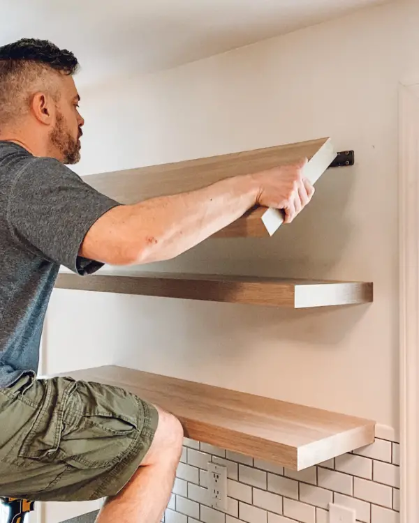 Sliding the shelves onto the brackets