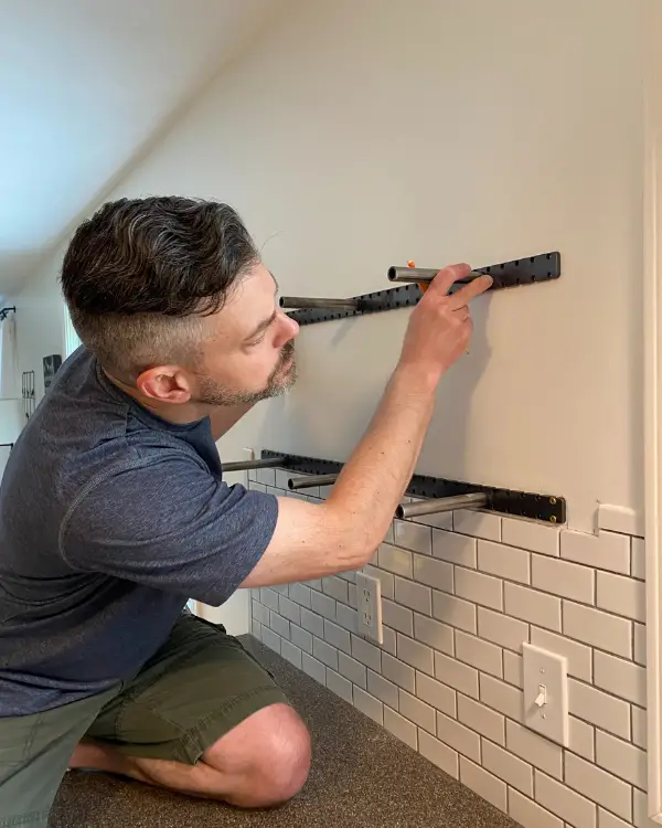 Hanging the brackets for the open shelves