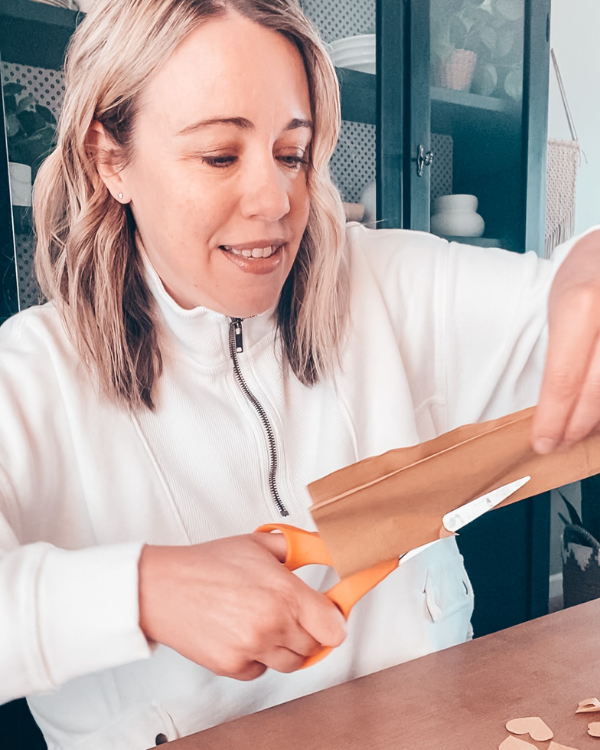 Cut hearts out of napkins to make your DIY Valentine's Day planter.