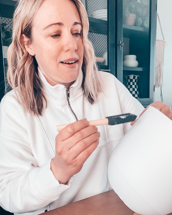 Paint Mod Podge onto the pot with a foam brush.