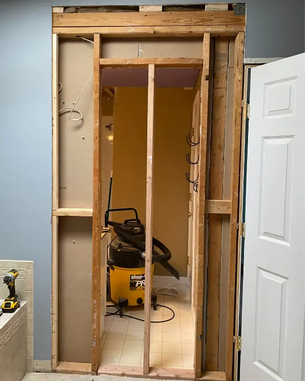 Bathroom Remodel: How to Fill in a Doorway with Drywall