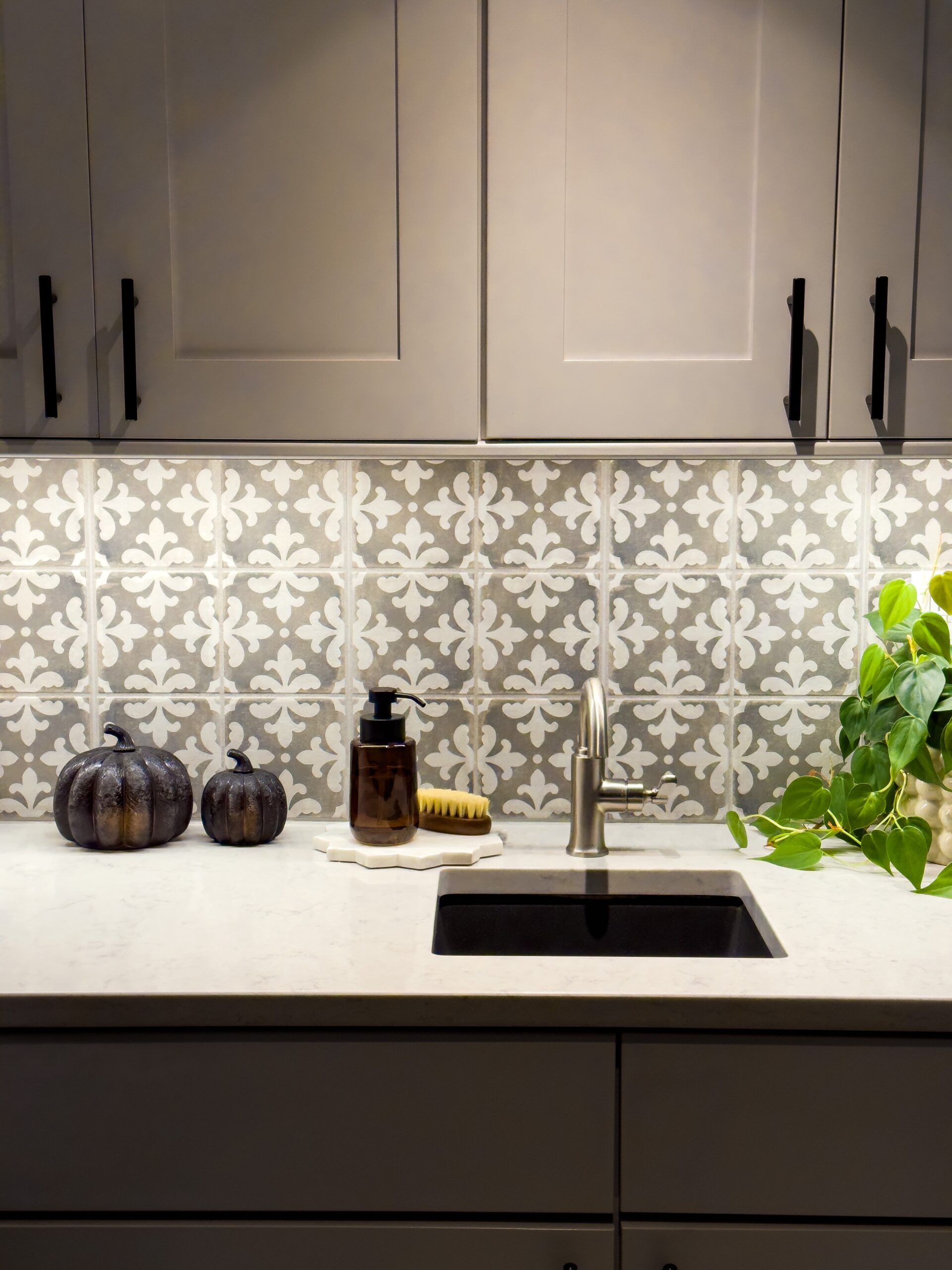 Place lit up pumpkins on the laundry room counter