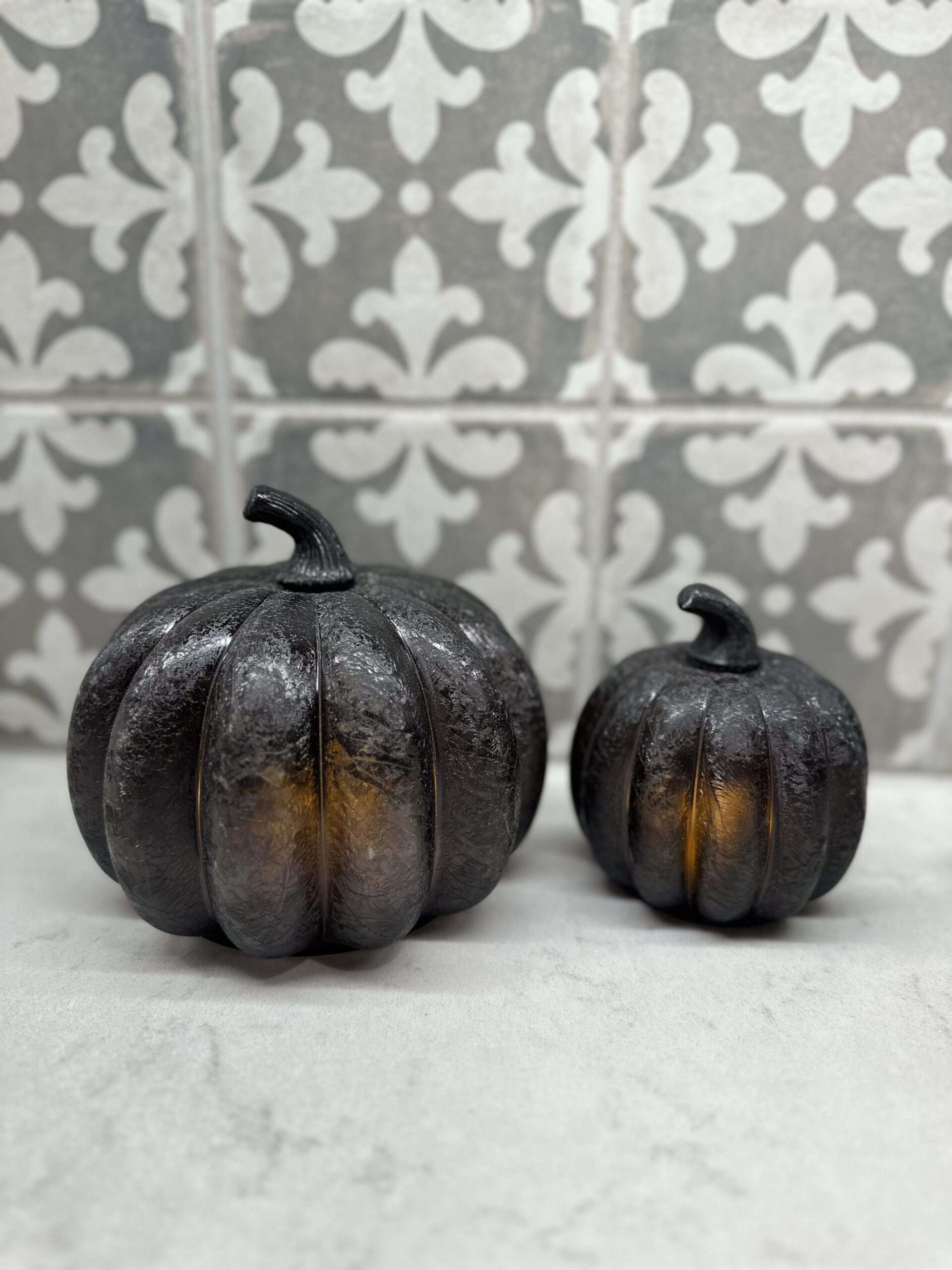 black glass pumpkins lit up