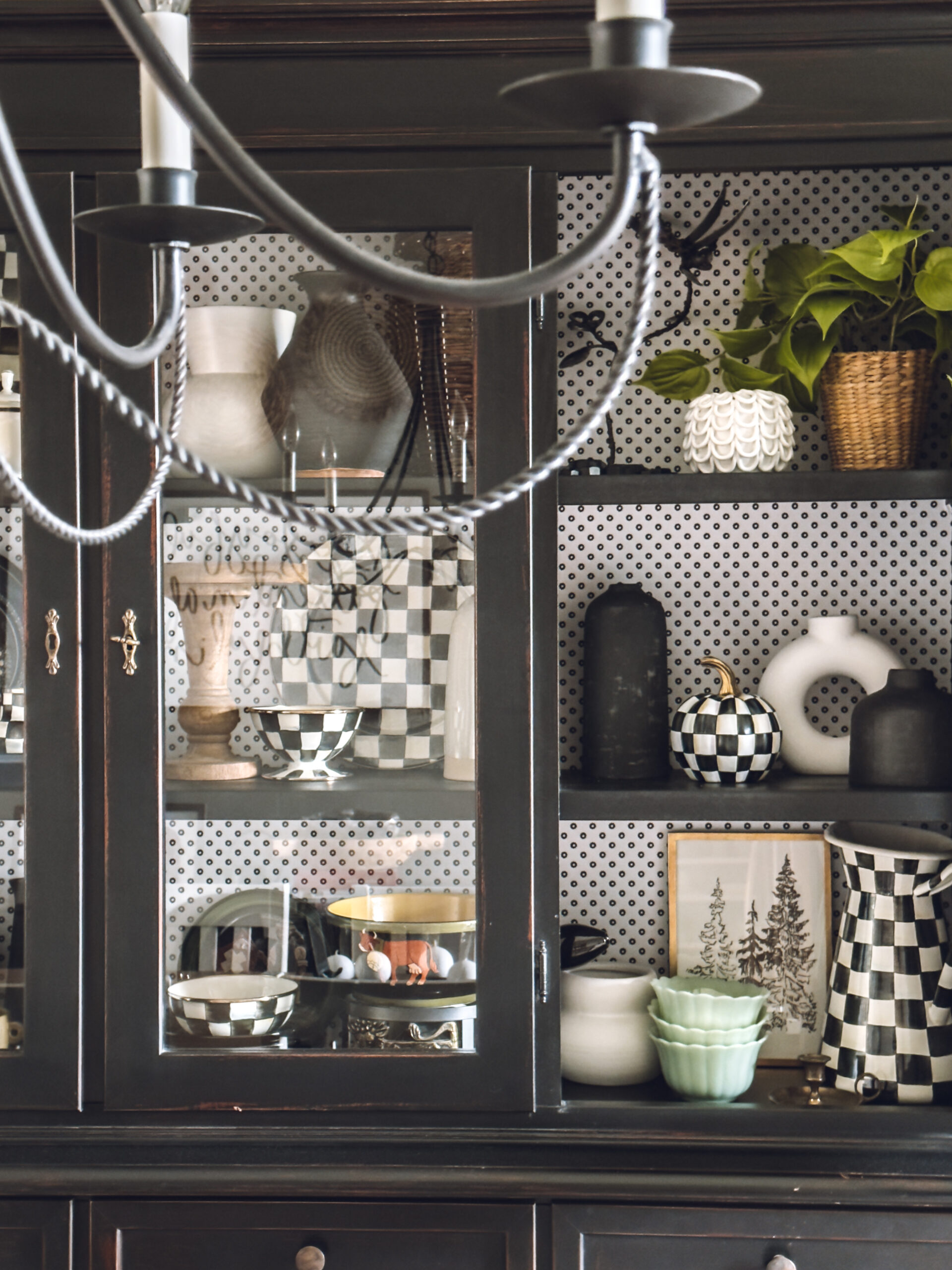 Have a collection of black and white checkered items including a Mackenzie Childs pumpkin