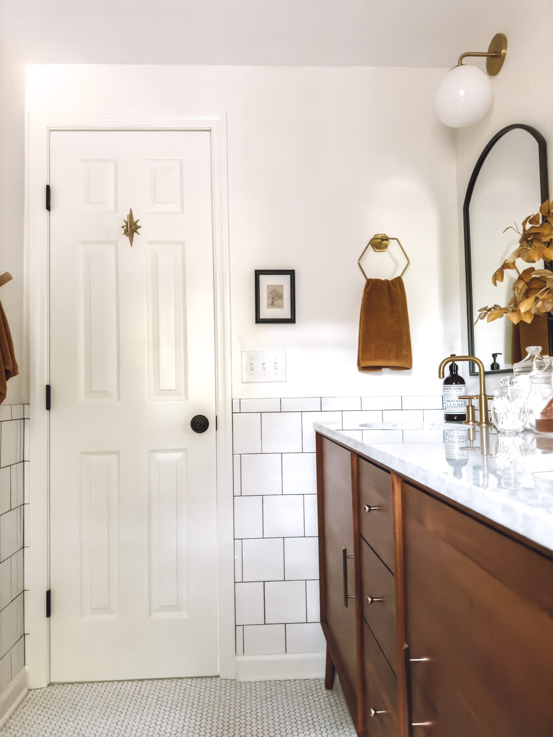 fall colored hand towel hanging in the bathroom