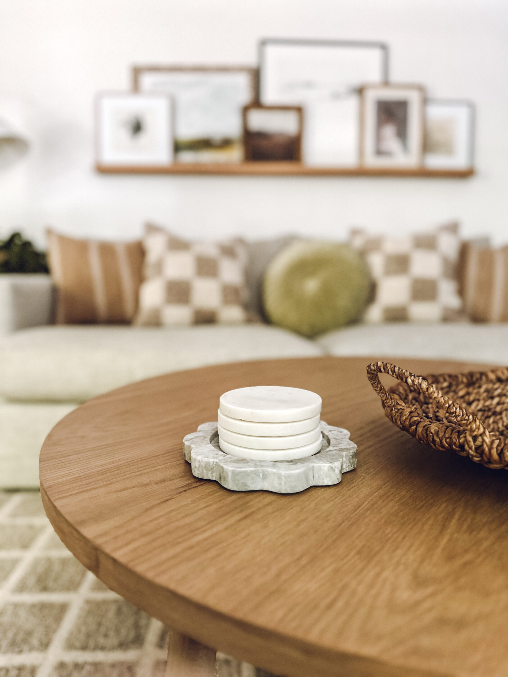 Stacking coasters on a small, round marble tray on the coffee table