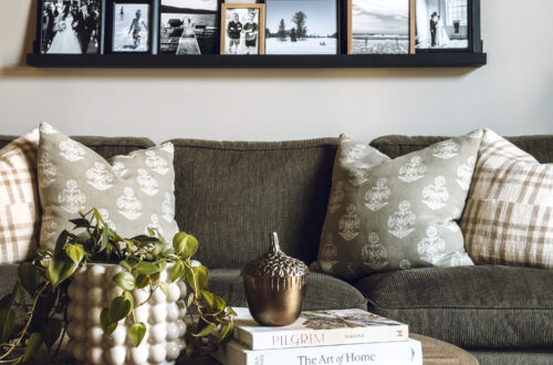 photo ledges displaying all black and white photos in only black or natural wood frames